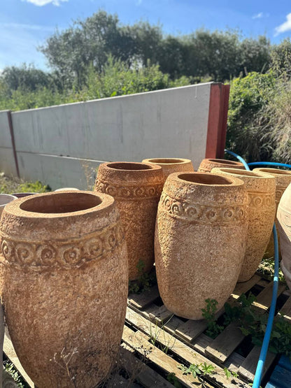 large stone pots in a uk garden